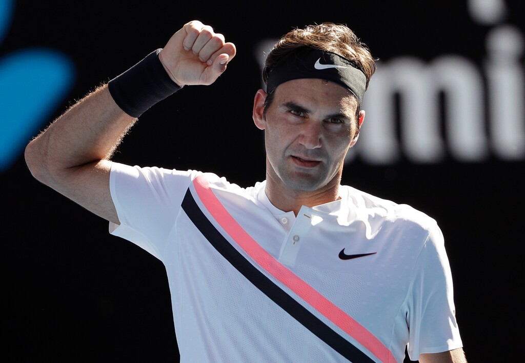 Switzerland's Roger Federer celebrates after defeating Hungary's Marton Fucsovics in their fourth round match at the Australian Open tennis championships in Melbourne, Australia, Monday, Jan. 22, 2018.(AP Photo/Dita Alangkara)