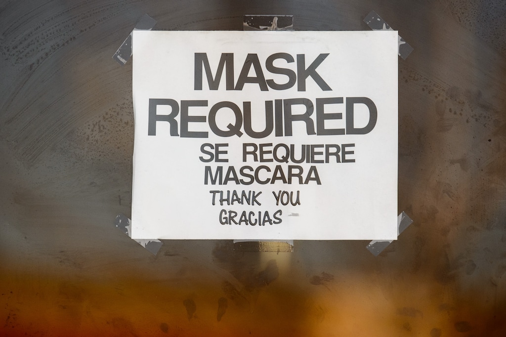 (Trent Nelson  |  The Salt Lake Tribune) A sign indicates masks are required at a store in West Valley City on Tuesday, March 16, 2021.