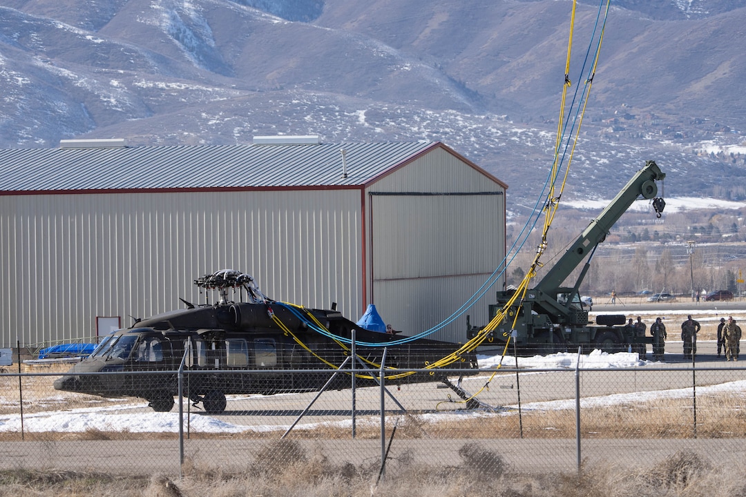 (Francisco Kjolseth | The Salt Lake Tribune) Recovery operations for two Utah Army National Guard UH-60 Black Hawk helicopters involved in a training accident in the Mineral Basin area last week are performed by a CH-47 Chinook helicopter and brought to the Heber Valley Airport on Wednesday, March 2, 2022.
