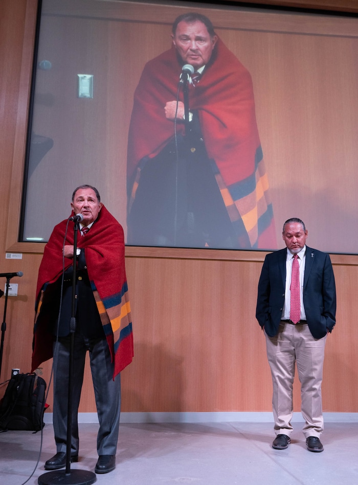(Francisco Kjolseth | The Salt Lake Tribune) Former Utah governor Gary Herbert, left, is honored and presented with a blanket by Dustin Jansen, director of the Utah Division of Indian Affairs, during the 15th Annual Governor’s Native American Summit held on the Utah Valley University campus on Friday, Aug. 6, 2021.