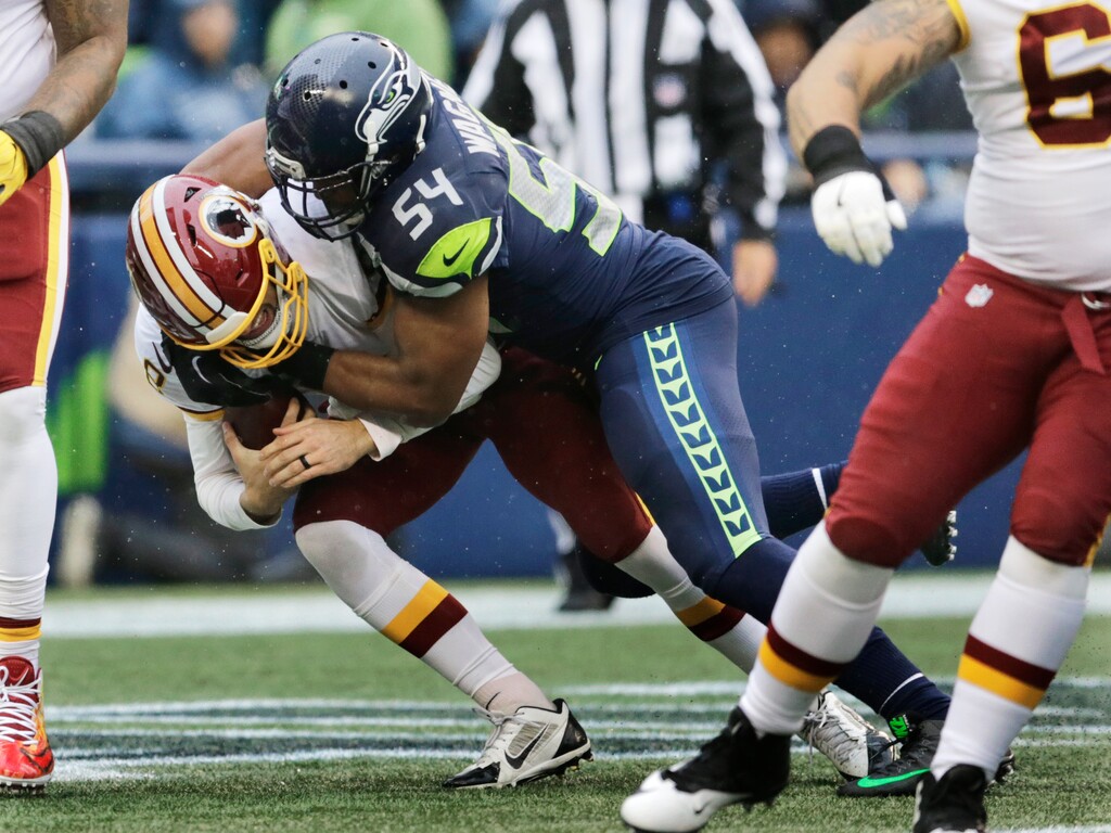 Seattle Seahawks middle linebacker Bobby Wagner (54) tackles Washington quarterback Kirk Cousins for a safety in the first half of an NFL football game, Sunday, Nov. 5, 2017, in Seattle. (AP Photo/Stephen Brashear)