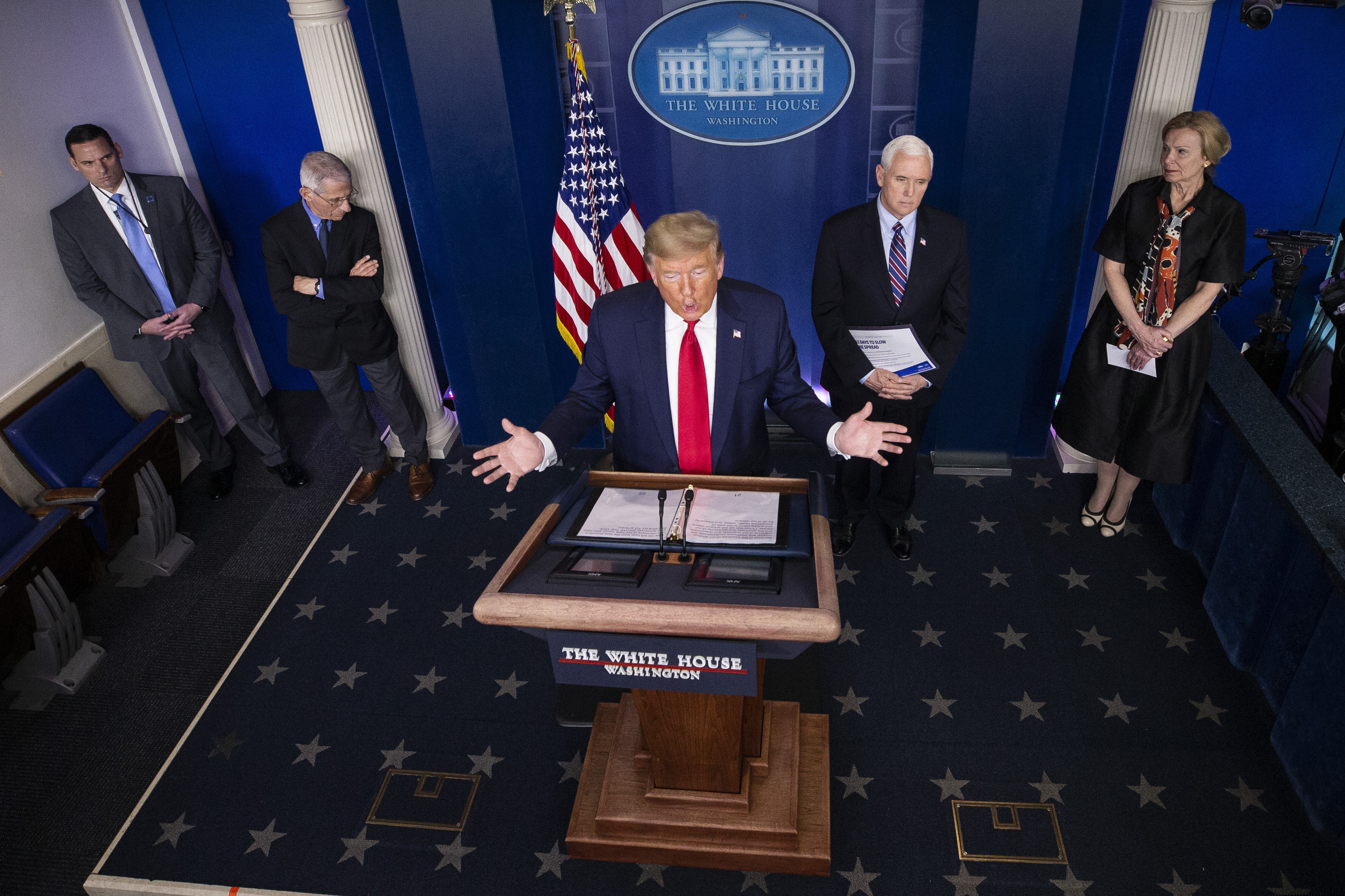 President Donald Trump speaks about the coronavirus accompanied by Dr. Anthony Fauci, left, director of the National Institute of Allergy and Infectious Diseases, Vice President Mike Pence, and Dr. Deborah Birx, White House coronavirus response coordinator, in the James Brady Briefing Room, Thursday, March 26, 2020, in Washington. (AP Photo/Alex Brandon)