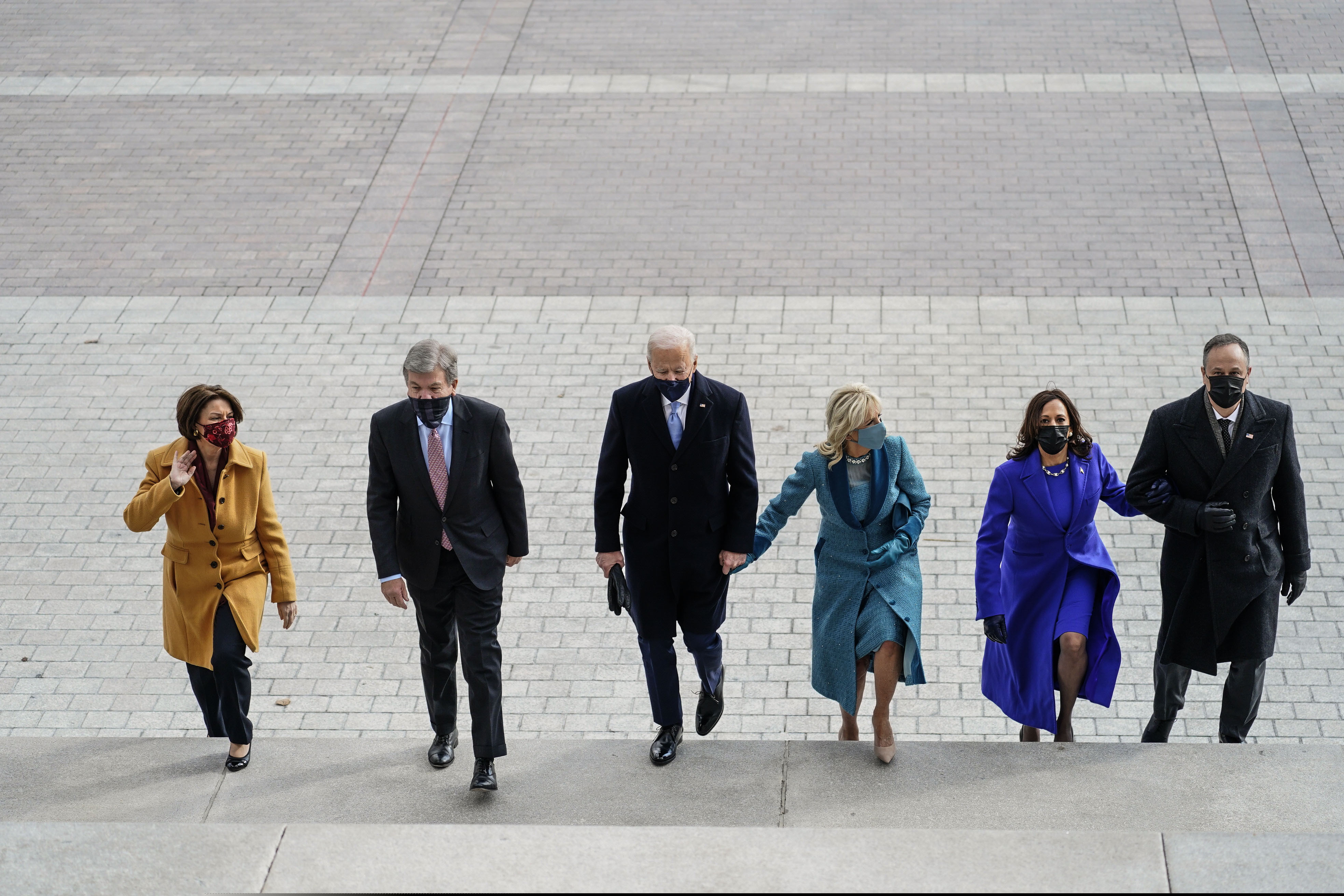 (Melina Mara | The Washington Post via AP, Pool) From left, Amy Klobuchar, D-Minn., Sen. Roy Blunt, R-Mo., President-elect Joe Biden, Jill Biden, Vice President-elect Kamala D. Harris and Doug Emhoff, walk up the steps of the U.S. Capitol ahead of Biden’s inauguration, Wednesday, Jan. 20, 2021.