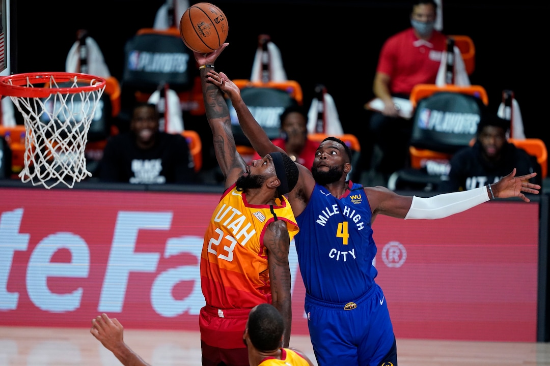 (Ashley Landis | AP) Utah Jazz's Royce O'Neale (23) and Denver Nuggets' Paul Millsap (4) battle for a rebound during the second half of an NBA basketball first round playoff game Friday, Aug. 21, 2020, in Lake Buena Vista, Fla.