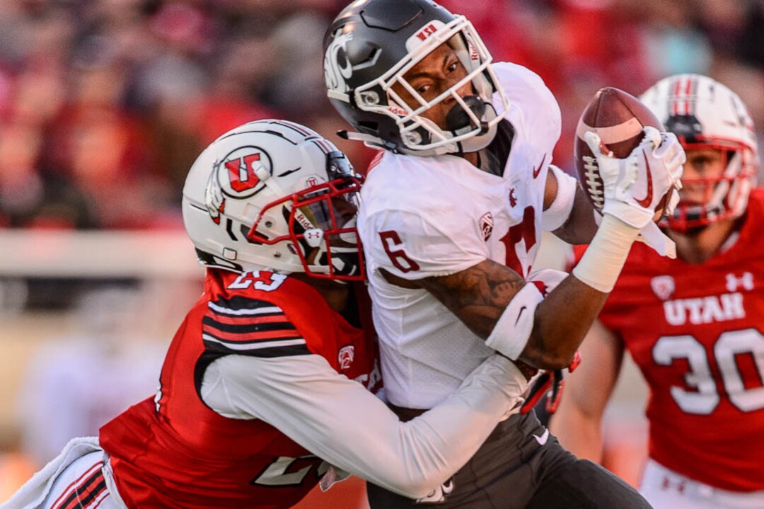 (Trent Nelson | The Salt Lake Tribune)  Utah Utes defensive back Julian Blackmon (23) wraps up Washington State Cougars wide receiver Jamire Calvin (6) as the University of Utah hosts Washington State, NCAA football in Salt Lake City, Saturday November 11, 2017.