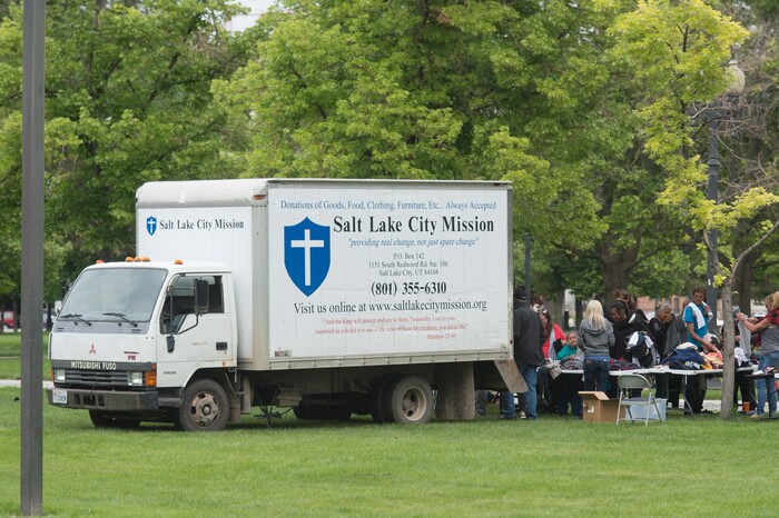 (Rick Egan  |  The Salt Lake Tribune)      
The Salt Lake City Mission distributes clothes to the homeless in Pioneer Park on Memorial day, Monday, May 28, 2018.


 