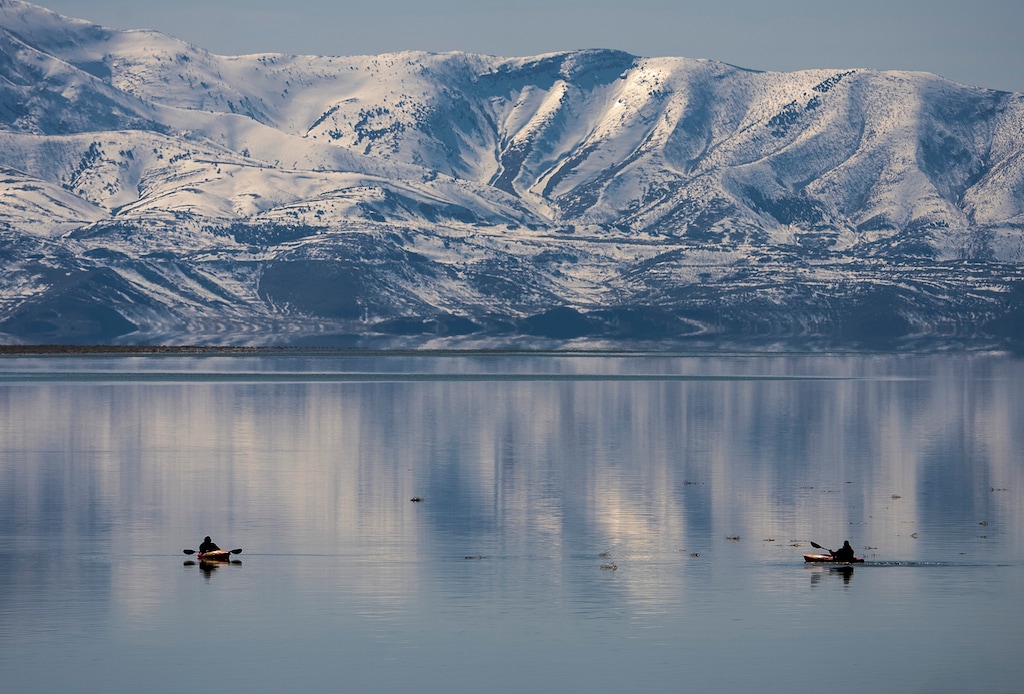 (Leah Hogsten | The Salt Lake Tribune) Two kayakers float the Great Salt Lake on Thursday, April 6, 2023.