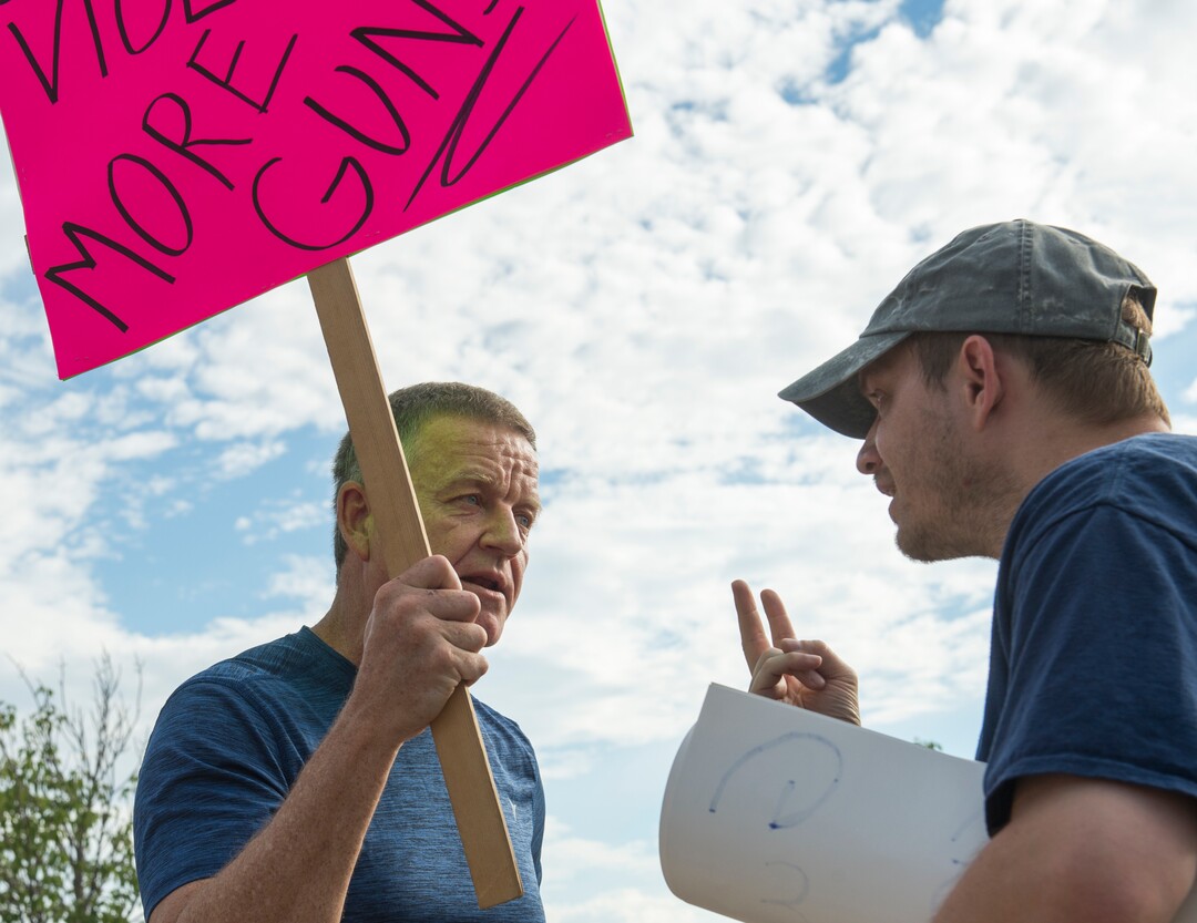 (Rick Egan  |  The Salt Lake Tribune)   Eric Wilson argues with Jason Jackson before a town hall meeting in Sandy, where survivors from the Florida school shooting held a forum with Utah students involved with the March for Our Lives movement, Saturday, July 14, 2018.