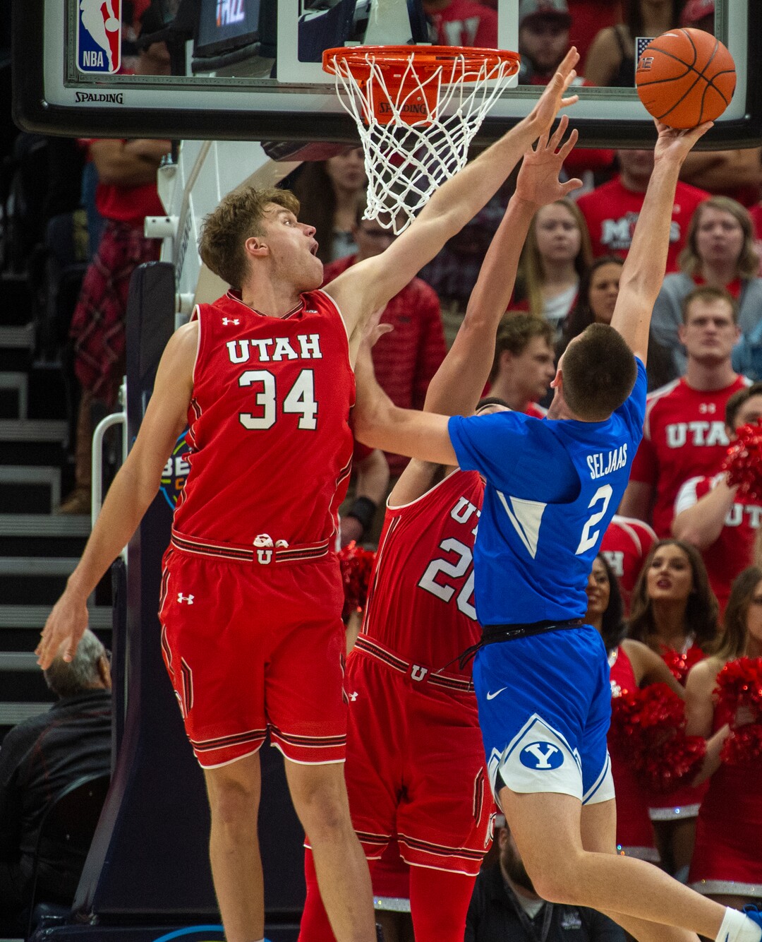 (Rick Egan  |  The Salt Lake Tribune)   Brigham Young Cougars guard Zac Seljaas shots, as Utah Utes center Jayce Johnson (34) shoots, in basketball action in the Beehive Classic, between against the Brigham Young Cougars and Utah Utes, at the Vivint Smart Home Arena, Saturday December 8, 2018.
