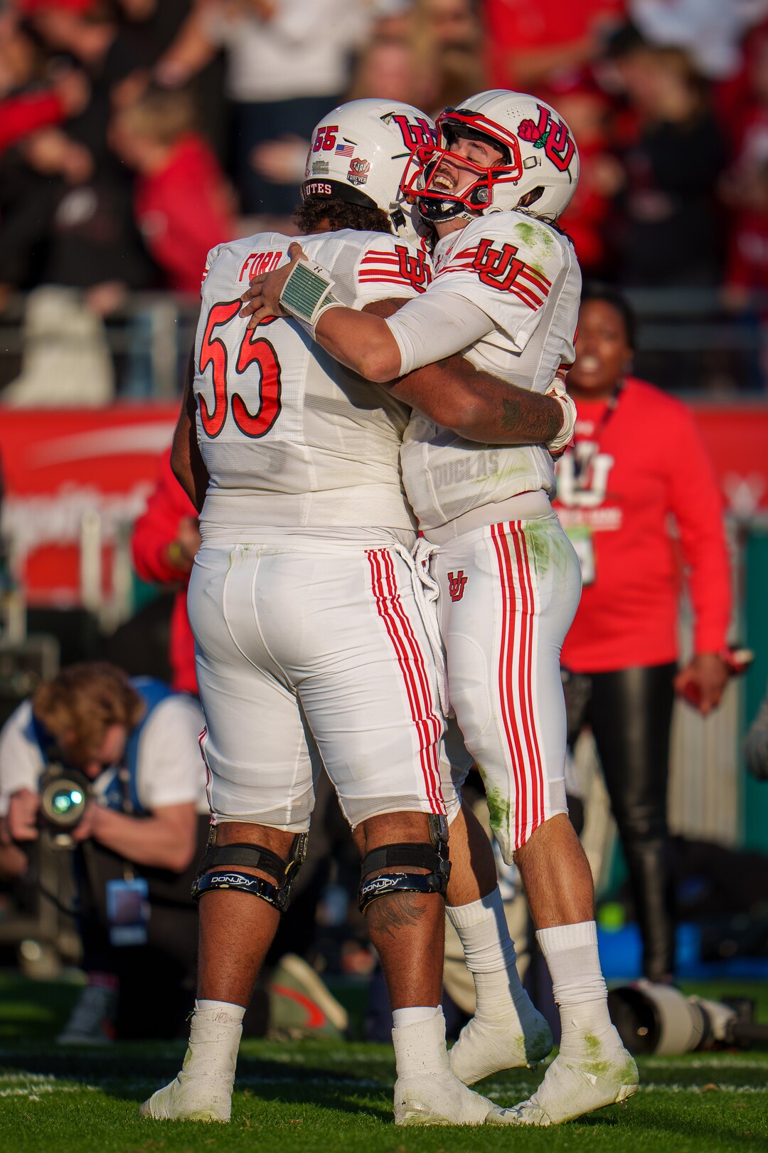(Trent Nelson  |  The Salt Lake Tribune) Utah Utes quarterback Cameron Rising (7) cleebrates a touchdown with Utah Utes offensive lineman Nick Ford (55) as the Utah Utes face the Ohio State Buckeyes at the Rose Bowl in Pasadena, Calif., on Saturday, Jan. 1, 2022.