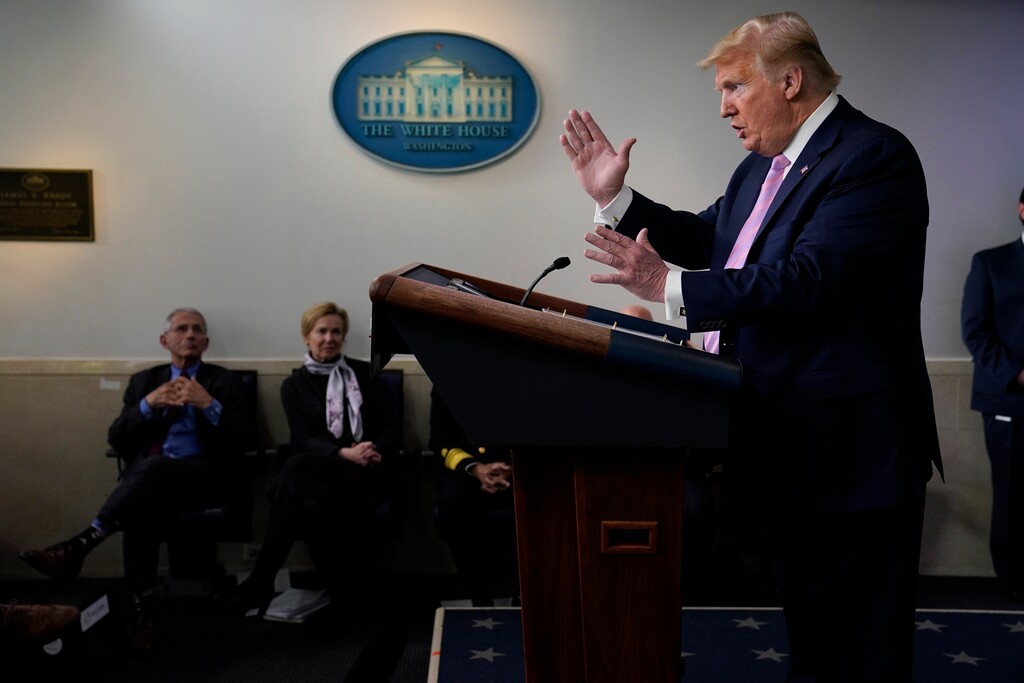 (Evan Vucci | AP file photo)  In this April 10 photo, President Donald Trump speaks during a coronavirus task force briefing at the White House. Director of the National Institute of Allergy and Infectious Diseases Dr. Anthony Fauci, left, and White House coronavirus response coordinator Dr. Deborah Birx, second from left, listen.