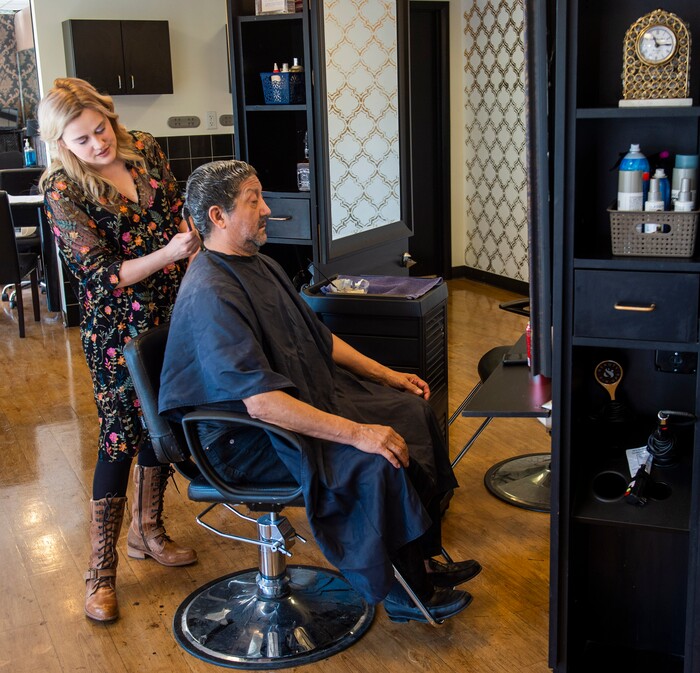 (Rick Egan  |  The Salt Lake Tribune)     Alyssa Brown styles Edward Santillanes hair at Mid City Salon, Saturday, March 21, 2020.