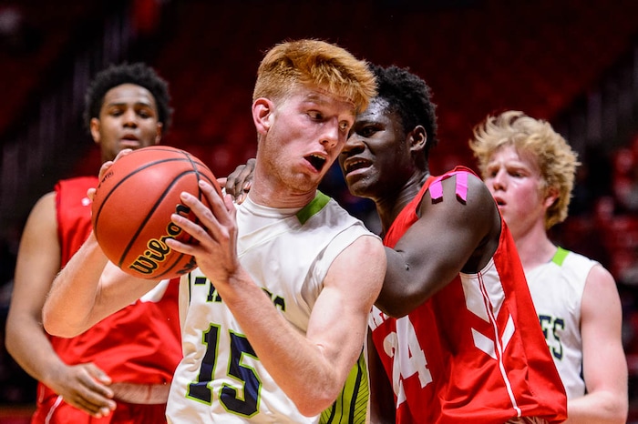 (Trent Nelson | The Salt Lake Tribune)  East vs. Timpanogos, 5A State high school basketball tournament at the Huntsman Center in Salt Lake City, Wednesday Feb. 28, 2018. Timpanogos's Tyler Walker (15) and East's Andre Mulibea (24).