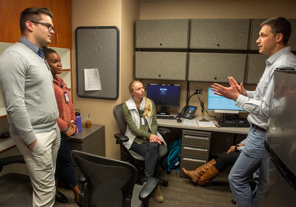(Rick Egan  |  The Salt Lake Tribune)       University of Utah Pharmacy Student Christopher Cahoon and Gilnou Pamphile and Abbey Smith listen to Dr. Adam Spivak, as they prepare for a clinic.  Spivak launched  a program at the UofU, to give free HIV preventive meds to the uninsured. Tuesday, Dec. 3, 2019.