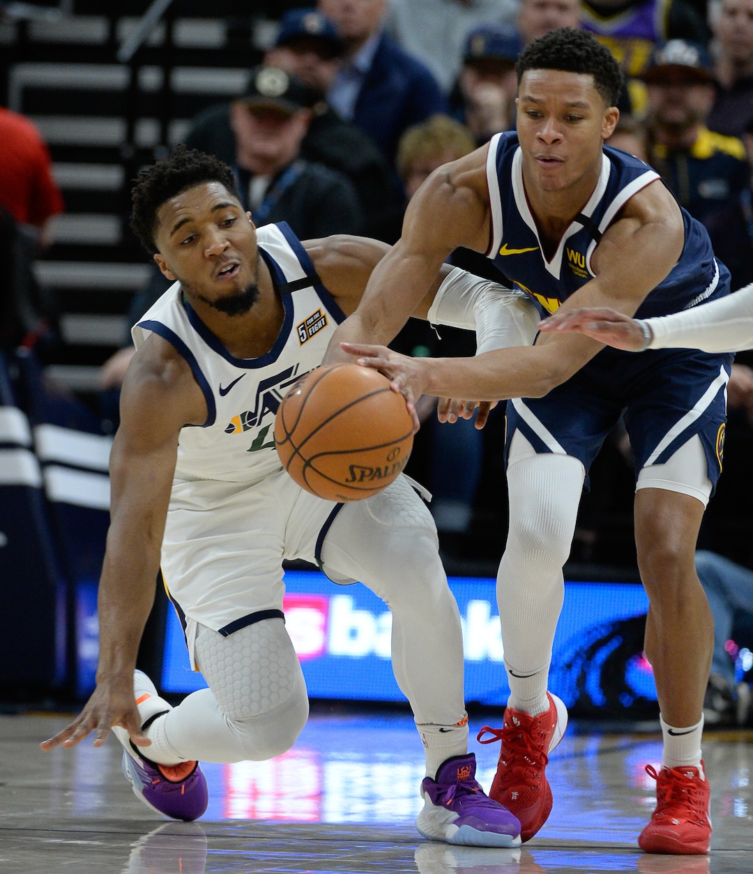 (Francisco Kjolseth  |  The Salt Lake Tribune) Utah Jazz guard Donovan Mitchell (45) loses the ball to Denver Nuggets guard PJ Dozier (35) as the Utah Jazz host the Denver Nuggets in their NBA basketball game at Vivint Smart Home Arena in Salt Lake City on Wednesday, Feb. 5, 2020.
