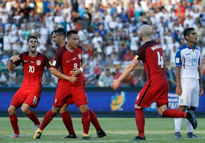 United States' Bobby Wood, 9, celebrates with teammates after scoring his team's first goal during a 2018 World Cup qualifying soccer match against Honduras in San Pedro Sula, Honduras, Tuesday, Sept. 5, 2017. (AP Photo/Rebecca Blackwell)
