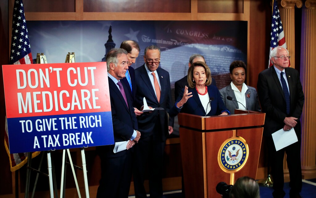 House Minority Leader Nancy Pelosi of Calif., front center, with Rep. Richard Neal, D-Mass., from left, Sen. Ron Wyden, D-Ore., Senate Minority Leader Chuck Schumer of New York, Rep. Barbara Lee, D-Calif., and Sen. Bernie Sanders, I-Vt., speaks during a news conference on Capitol Hill in Washington, Wednesday, Oct. 4, 2017, urging Republicans to abandon cuts to Medicare and Medicaid. (AP Photo/Manuel Balce Ceneta)