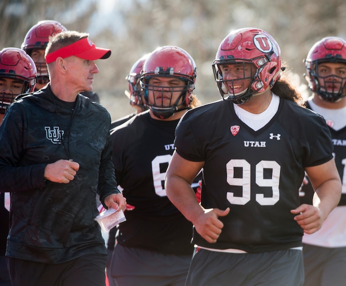 (Rick Egan  |  The Salt Lake Tribune)   Utah associate head coach/defensive line coach Gary Andersen chats with defensive lineman Leki Fotu (99), during the first day of Spring practice, Monday, March 5, 2018.


