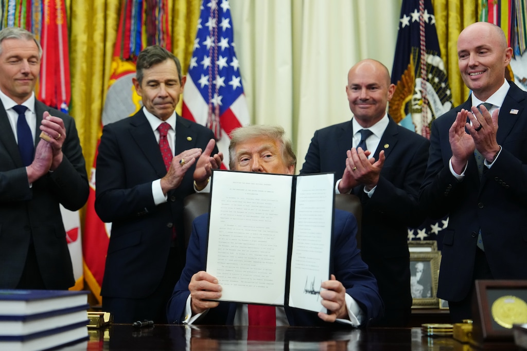 (Julia Demaree Nikhinson | AP) President Donald Trump holds an executive order modifying the Bears Ears National Monument in the Oval Office of the White House, Monday, July 13, 2026, in Washington. Behind Trump, from left: U.S. Rep. Mike Kennedy; U.S. Sens. John Curtis and Mike Lee; and Gov. Spencer Cox.