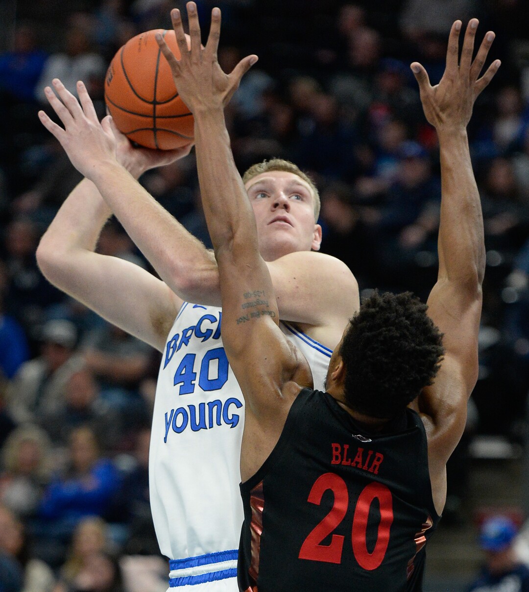 (Francisco Kjolseth  |  The Salt Lake Tribune)  Brigham Young Cougars forward Kolby Lee (40) goes up against UNLV Rebels forward Nick Blair (20) as BYU takes on UNLV in men's NCAA basketball at Vivint Smart Home Arena in Salt Lake City on Sat. Dec. 7, 2019.
