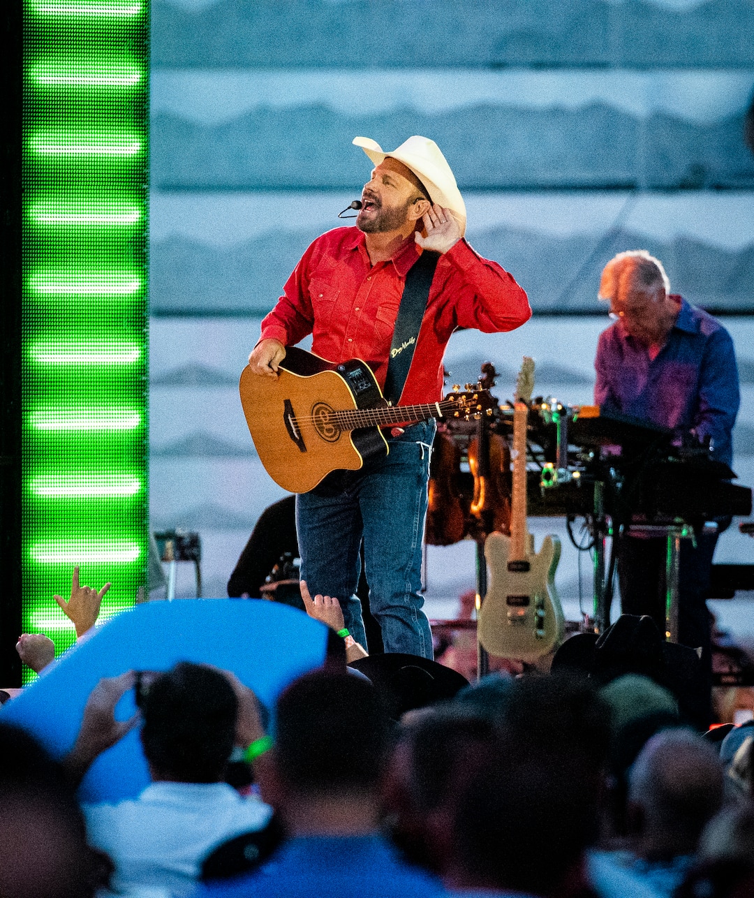 (Isaac Hale | Special to The Tribune) Garth Brooks gestures to the crowd as he performs with his band during a stop on their stadium tour held at Rice-Eccles Stadium in Salt Lake City on Saturday, July 17, 2021.
