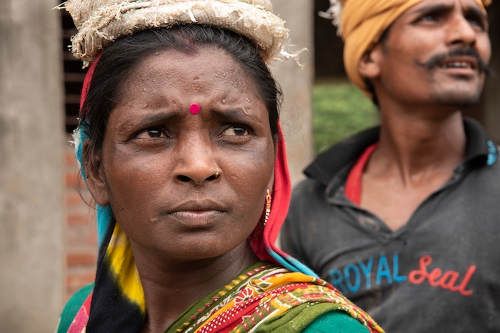 (Saumya Khandelwal | The New York Times) Rabita and her husband Ashok Kumar, at the construction site where they both work and live in Lucknow, India, July 28, 2020. Around the world, the poor and marginalized are much more likely to be vulnerable to extreme heat; Rabita and her husband are Dalits, at the bottom of the Hindu caste ladder, working to pay off their debts.