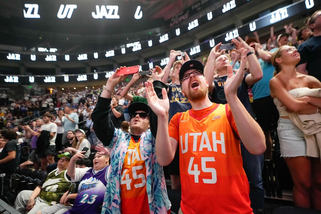 (Francisco Kjolseth | The Salt Lake Tribune) Utah Jazz fans Cayleb Pearson, left, and Sean Mullins cheer at the Delta Center in Salt Lake City as the Jazz selected Taylor Hendricks with the No. 9 pick in the NBA basketball draft, Thursday, June 22, 2023.