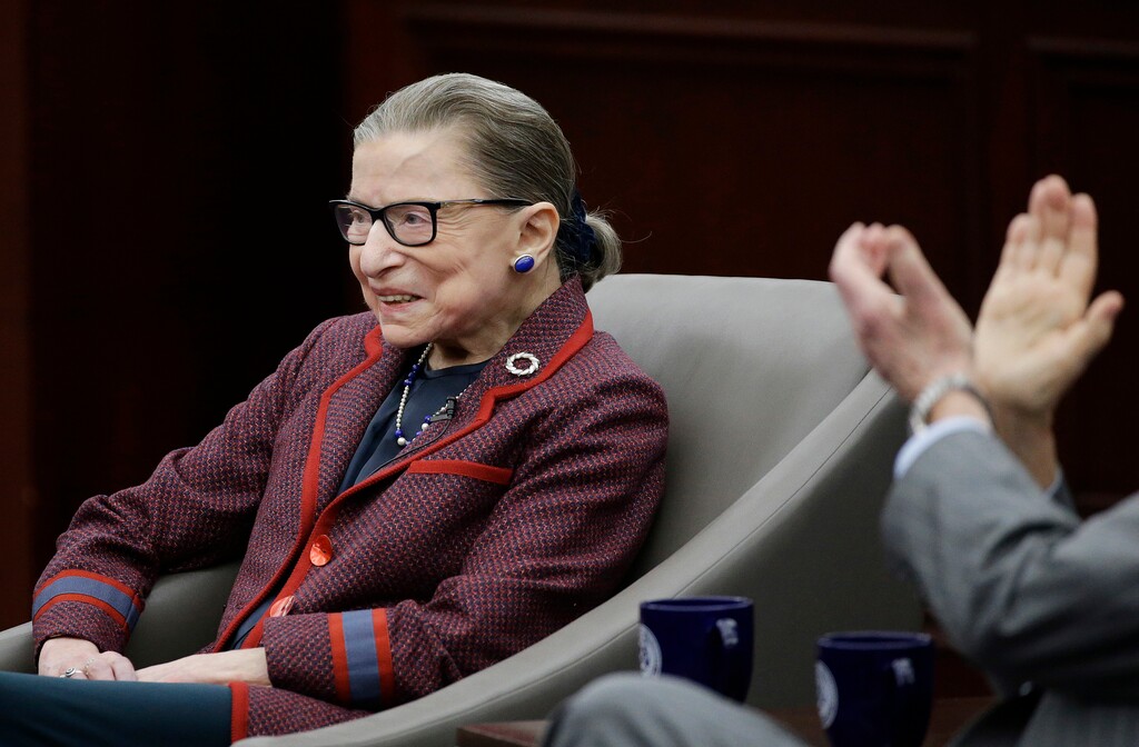 (Stephan Savoia | The Associated Press) Supreme Court Justice Ruth Bader Ginsburg is applauded as she begins her participation in a "fireside chat" in the Bruce M. Selya Appellate Courtroom at the Roger William University Law School on Tuesday, Jan. 30, 2018, in Bristol, R.I.