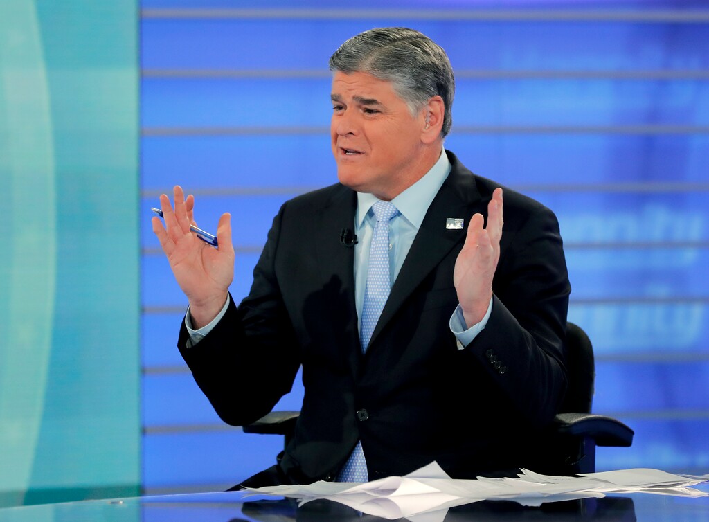 FILE - In this July 26, 2018, file photo, Fox News talk show host Sean Hannity talks during an interview during a taping of his show in New York. Bad news for President Donald Trump also means a tough time for his biggest media backer, Fox News’ Hannity. His ratings are down since the election, and his rivals are up. Still, Fox will finish as the top-rated network in all of basic cable for the third straight year. (AP Photo/Julie Jacobson, File)