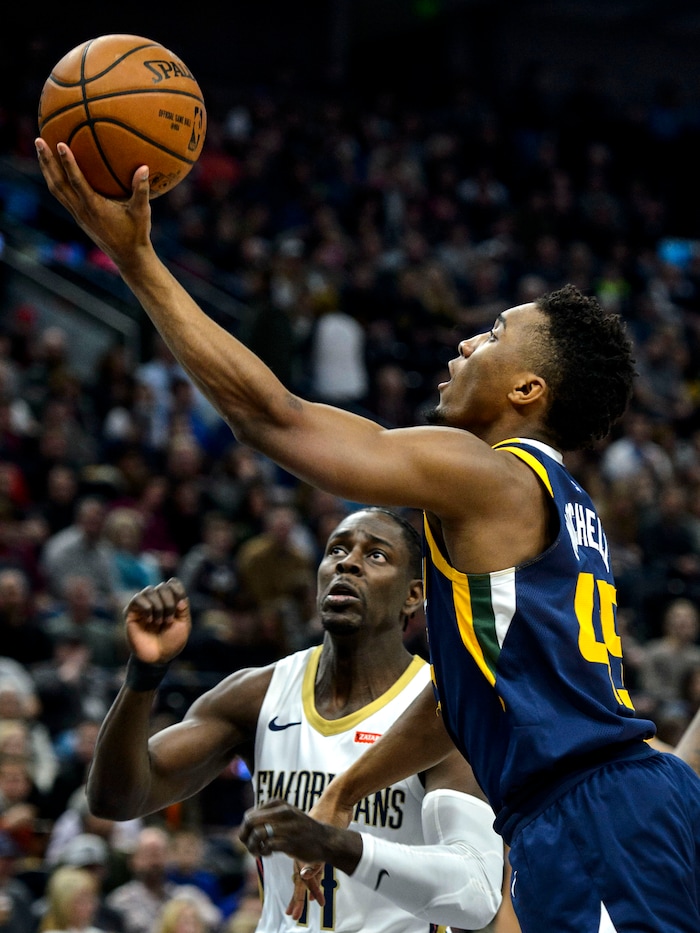 (Steve Griffin  |  The Salt Lake Tribune) Utah Jazz guard Donovan Mitchell (45) scoops up a shot during the the Utah Jazz versus the New Orleans Pelicans NBA basketball game at the Vivint Smart Home Arena in Salt Lake City Wednesday January 3, 2018.