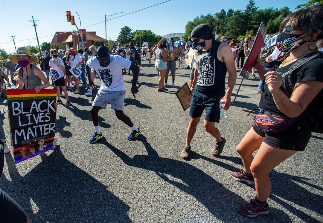 (Rick Egan  |  The Salt Lake Tribune)     Protesters dance on Foothill Drive, during a march for Justice in Salt Lake City, on Sunday, July 12, 2020.