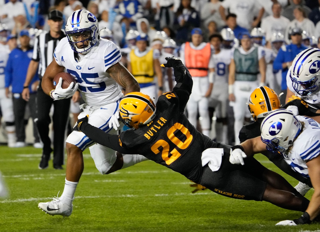 (Francisco Kjolseth | The Salt Lake Tribune) Brigham Young Cougars defensive back Talan Alfrey (25) is pressured by Arizona State Sun Devils linebacker Darien Butler in football action between the Brigham Young Cougars and the Arizona State Sun Devils at LaVell Edwards Stadium in Provo, on Saturday, Sept. 18, 2021.