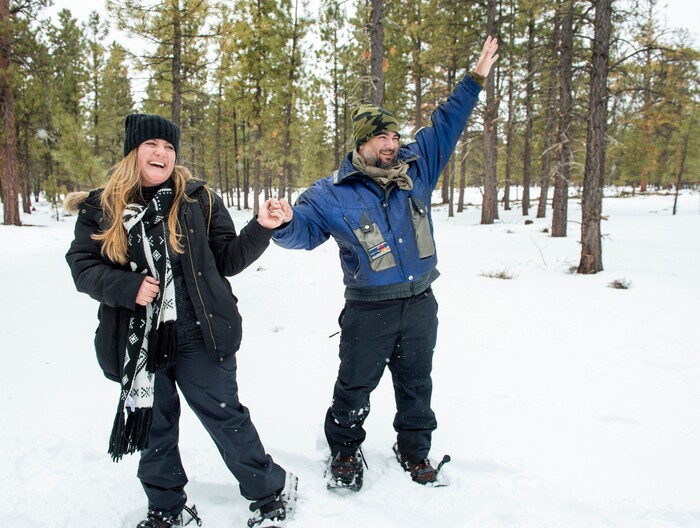 (Rick Egan | The Salt Lake Tribune) Nicole Erdmann reacts as Erik Garcia proposes to her, on a snowshoe tour of the Dixie National Forest during the 36th annual Ruby's Inn Bryce Canyon Winter Festival on Saturday, Feb. 13, 2021. Erdmann and Garcia are from Miami Florida.