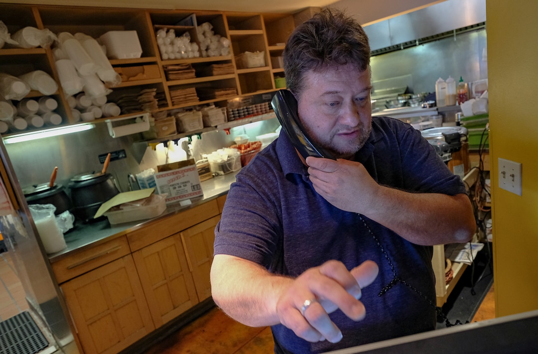 (Francisco Kjolseth  |  The Salt Lake Tribune) Manager Shon Evans takes a take out order on Saturday, March 7, 2020, at the popular Sampan Asian Cuisine restaurant in Salt Lalke City after operating for nearly three decades, where he has worked since the beginning.
