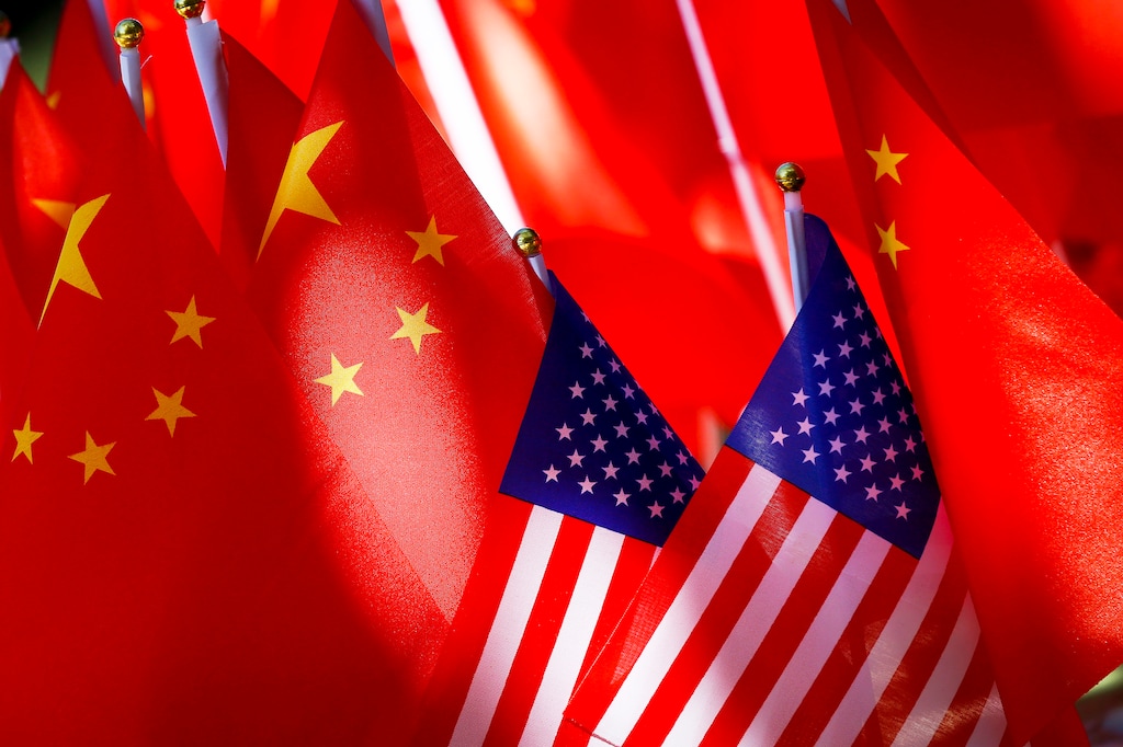 (Andy Wong | AP file photo) In this Sept. 16, 2018, file photo, American flags are displayed together with Chinese flags on top of a trishaw in Beijing. The Utah House on Tuesday backed a call to close Chinese Communist Party-funded Confucius Institutes at state universities.