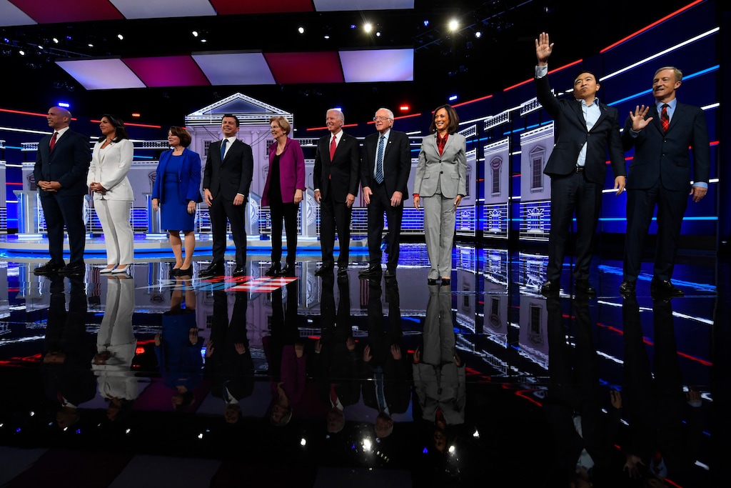 (John Amis | AP) Democratic presidential candidates from left, Sen. Cory Booker, D-N.J., Rep. Tulsi Gabbard, D-Hawaii, Sen. Amy Klobuchar, D-Minn., South Bend, Ind., Mayor Pete Buttigieg, Sen. Elizabeth Warren, D-Mass., former Vice President Joe Biden, Sen. Bernie Sanders, I-Vt., Sen. Kamala Harris, D-Calif., former technology executive Andrew Yang and investor Tom Steyer wave to the audience before a Democratic presidential primary debate, Wednesday, Nov. 20, 2019, in Atlanta.