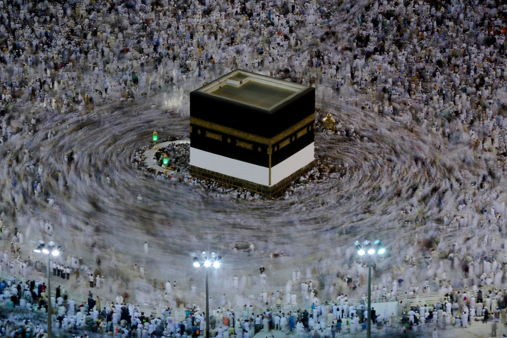 (AP Photo/Dar Yasin) In this Aug. 16, 2018, photo taken with a long exposure, Muslim pilgrims circle the Kaaba as they pray at the Grand Mosque, ahead of the annual Hajj pilgrimage in the Muslim holy city of Mecca, Saudi Arabia. The annual Islamic pilgrimage draws millions of visitors each year, making it the largest yearly gathering of people in the world.