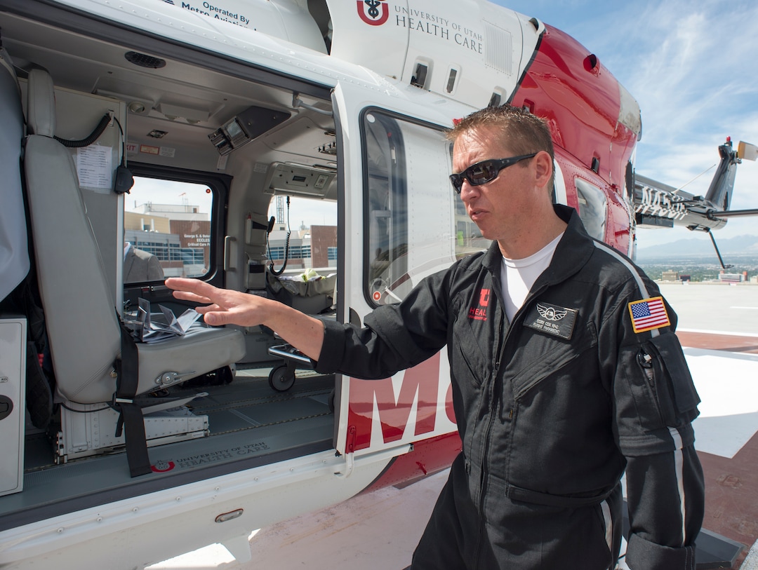 (Rick Egan  |  The Salt Lake Tribune)       Flight paramedic Corey Cox talks about one of the AirMed helicopters. The University of Utah serves the single biggest geographic area of any academic medical center in the United States.  Thursday, May 31, 2018.