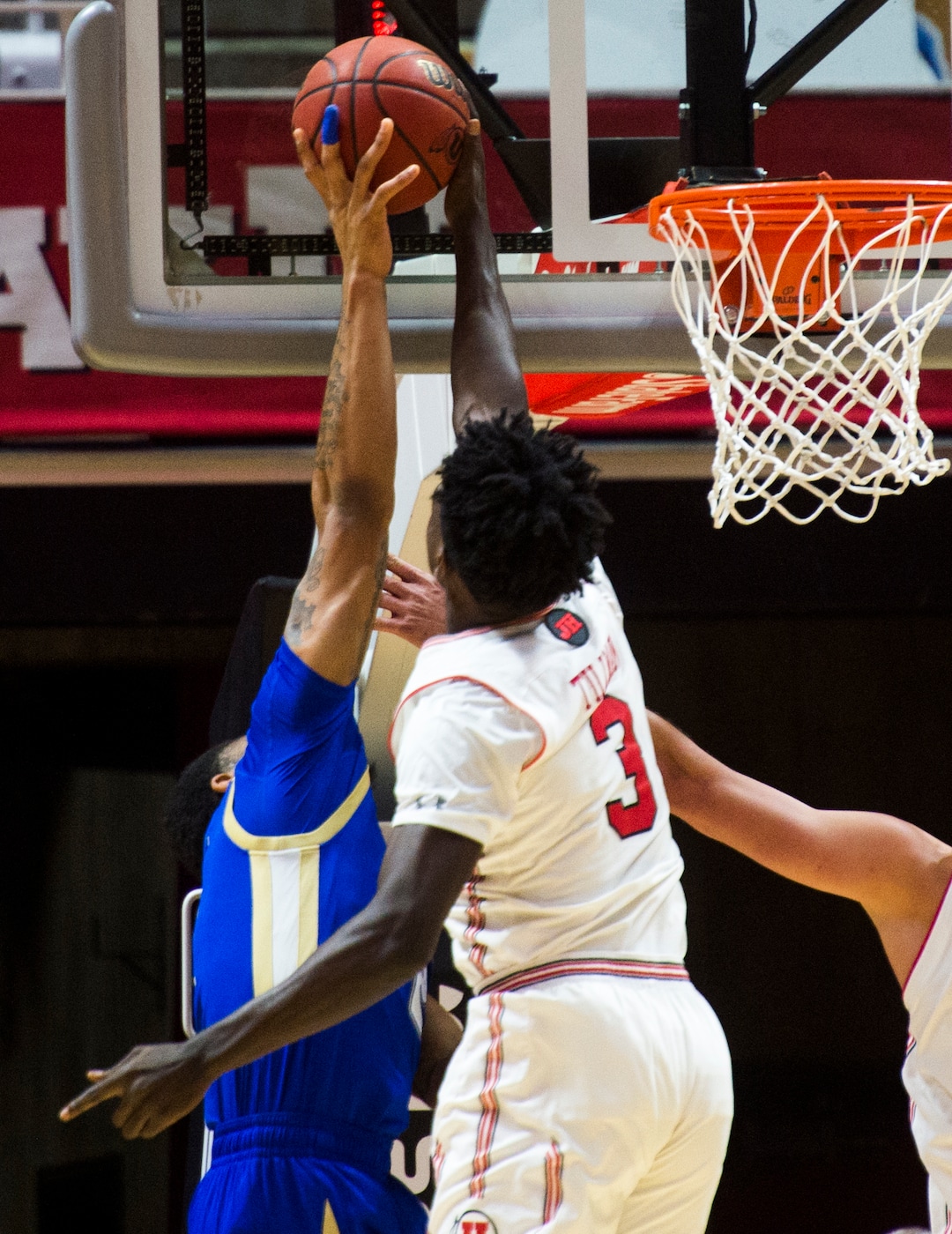 (Rick Egan  |  The Salt Lake Tribune)      Utah Utes forward Donnie Tillman (3) blocks a shot by Tulsa Golden Hurricane guard DaQuan Jeffries (2), in basketball action between, Utah Utes and Tulsa Golden Hurricane, at the Jon M. Huntsman Center, Saturday, Dec. 1, 2018.
