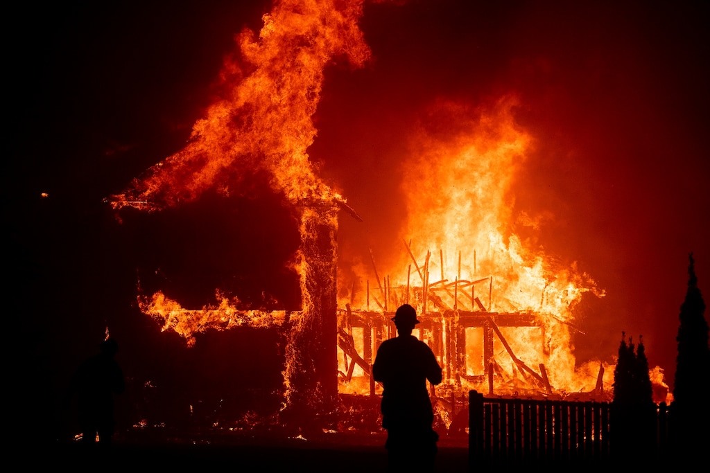 (Noah Berger | AP file photo)

In this Nov. 8, 2018, photo a home burns as the Camp Fire rages through Paradise, Calif.