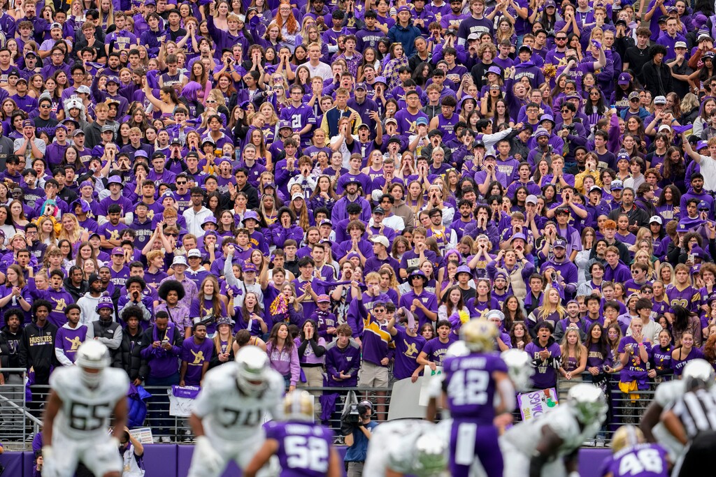 Fans in the Washington student section watch during the first half of an NCAA college football game between Washington and Oregon, Saturday, Oct. 14, 2023, in Seattle. (AP Photo/Lindsey Wasson)