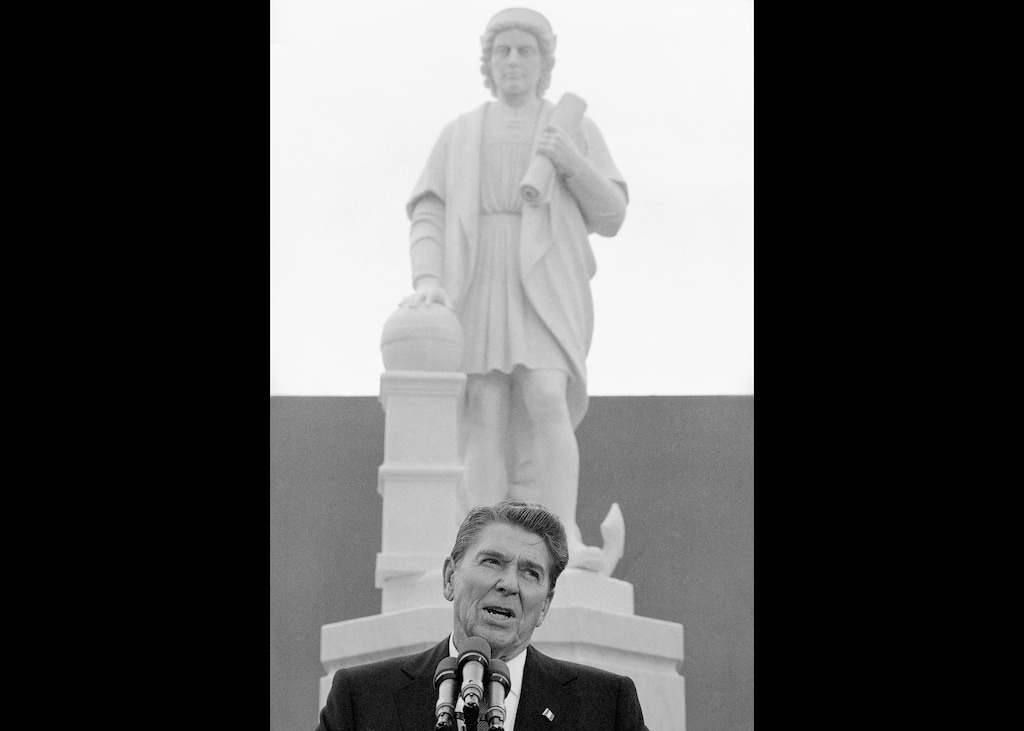 (Lana Harris | AP file photo) President Ronald Reagan addresses a ceremony in Baltimore, to unveil a statue of Christopher Columbus on Oct. 9, 1984. Baltimore protesters pulled down the statue of Christopher Columbus and threw it into the city's Inner Harbor, Saturday, July 4, 2020.