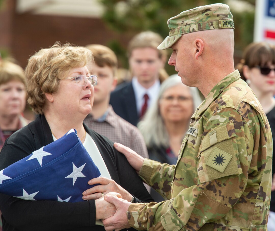 (Rick Egan  |  The Salt Lake Tribune)     Jon Richardson, Major with Utah National Guard, comforts Mary Ann Turner, the daughter of 2nd Lt. Lynn W. Hadfield, after the graveside service for her father, who was killed during the Second World War, at Veterans Memorial Park, in Bluffdale. Thursday, March 21, 2019.