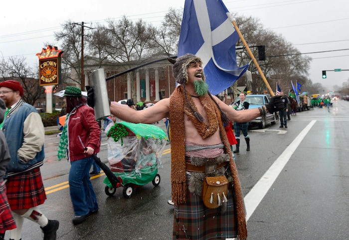 (Scott Sommerdorf | The Salt Lake Tribune) A member of the Utah Scottish Festival and Highland Games group yells to the crowd during the 40th annual Salt Lake City St. Patrick's Day Parade on Saturday, March 17, 2018.