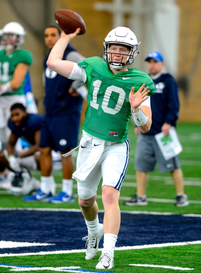 (Steve Griffin  |  The Salt Lake Tribune) BYU quarterback Joe Critchlow throws a pass during spring football practice for BYU in the indoor practice facility in Provo Thursday March 15, 2018.