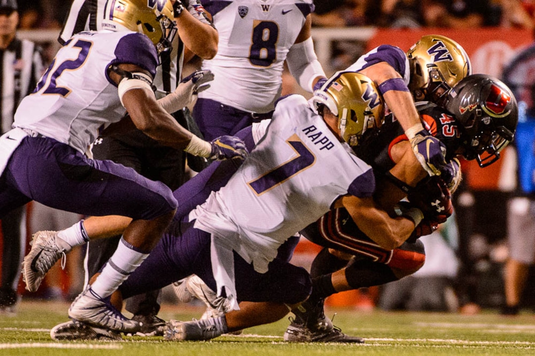 (Trent Nelson | The Salt Lake Tribune)  Utah Utes wide receiver Samson Nacua (45) is tackled as the University of Utah hosts Washington at Rice-Eccles Stadium in Salt Lake City, Saturday Sept. 15, 2018.