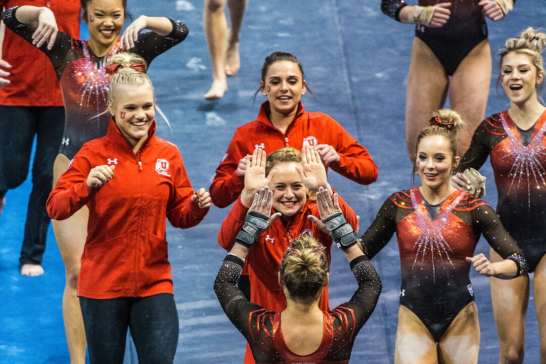 Chris Detrick  |  The Salt Lake TribuneTiffani Lewis celebrates with her teammates after competing on the vault during the gymnastics meet against Brigham Young University at the Marriott Center Friday January 13, 2017. 