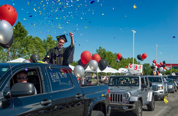 (Rick Egan  |  The Salt Lake Tribune)      Alta High graduate Evan Delahunty celebrates as he joins the parade of 2020 graduates in a “drive through” graduation ceremony at Alta High, Thursday, May 28, 2020.