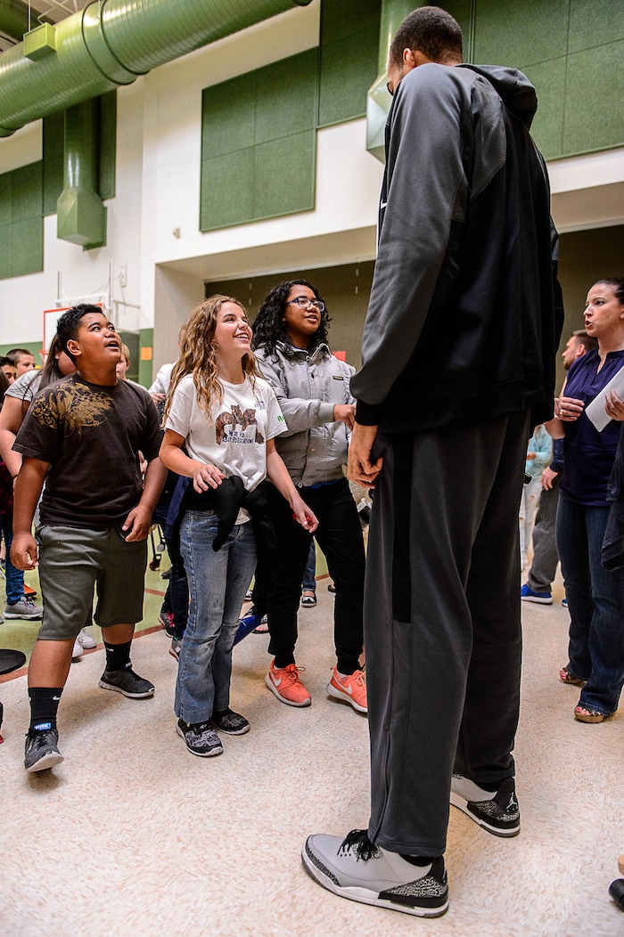 (Trent Nelson | The Salt Lake Tribune)  Utah Jazz center Rudy Gobert towers over young students at Foxboro Elementary, a French immersion school, in North Salt Lake, Wednesday September 20, 2017.
