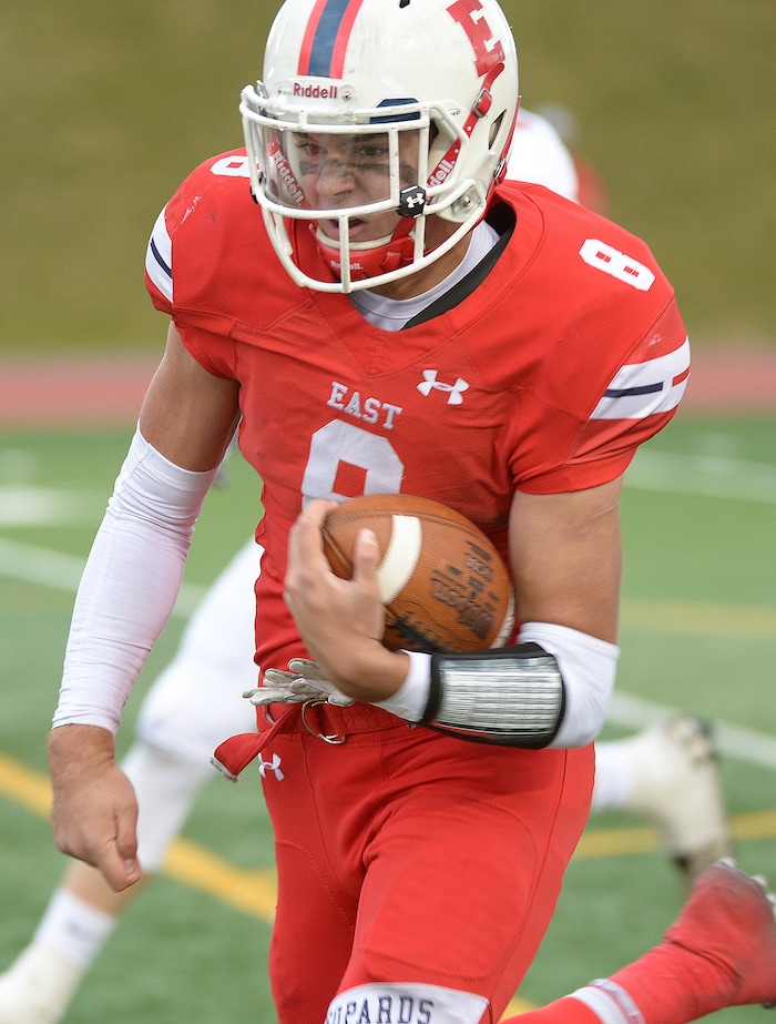 (Leah Hogsten  |  The Salt Lake Tribune) East's quarterback Ben Ford runs in a touchdown.  American Fork High School boys' football team East High School during their class 6A state quarterfinal football game, Friday, November 3, 2017
